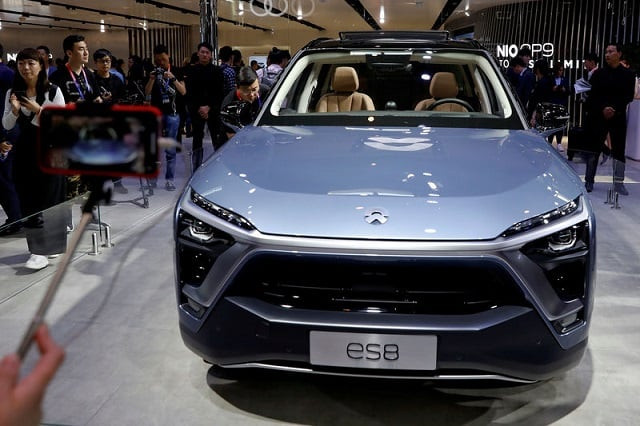 visitors check nio es8 displayed during a media preview of the auto china 2018 motor show in beijing china april 25 2018 photo reuters visitors check nio es8 displayed during a media preview of the auto china 2018 motor show in beijing china april 25 2018 photo reuters