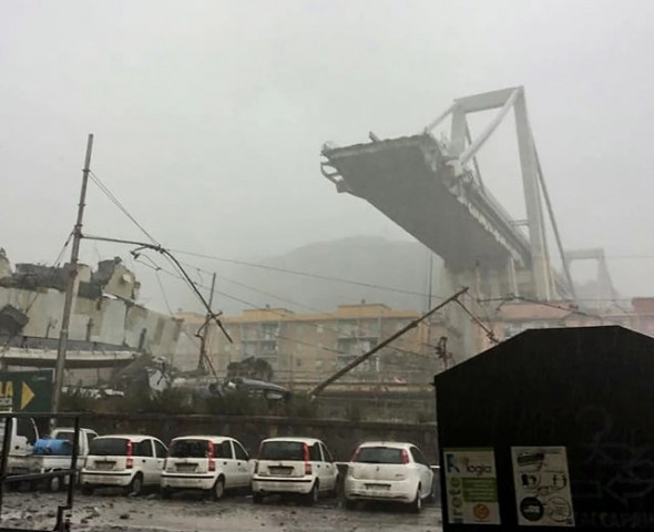 this handout picture provided by the italian police polizia di stato on august 14 2018 shows a collapsed section of a viaduct on the a10 motorway in genoa photo afp this handout picture provided by the italian police polizia di stato on august 14 2018 shows a collapsed section of a viaduct on the a10 motorway in genoa photo afp