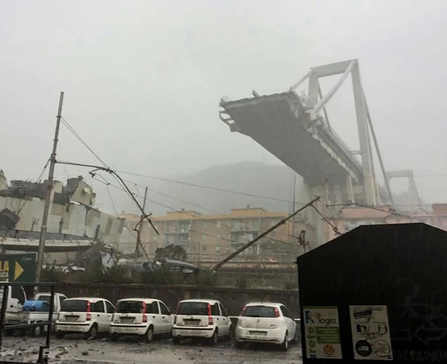 this handout picture provided by the italian police polizia di stato on august 14 2018 shows a collapsed section of a viaduct on the a10 motorway in genoa photo afp