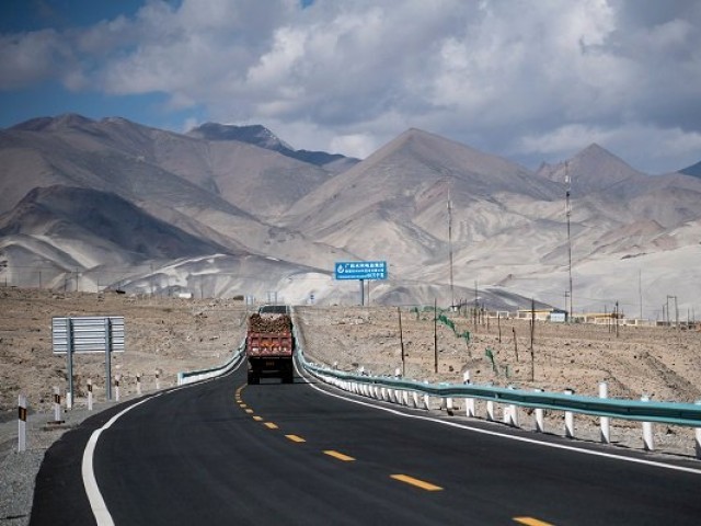 a truck moves along the china pakistan friendship highway before the karakoram mountain range near tashkurgan in china 039 s western xinjiang province photo afp