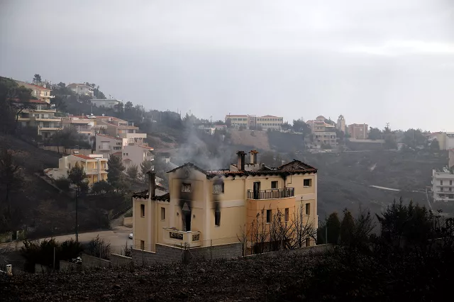 a house burns in the wake of a wildfire in neos voutzas near athens greece photo reuters a house burns in the wake of a wildfire in neos voutzas near athens greece photo reuters