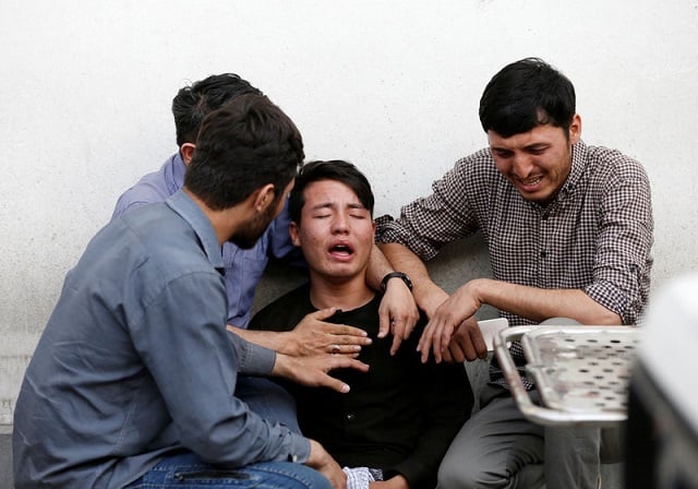 afghan men mourn after a blast in a hospital in kabul afghanistan august 15 2018 photo reuters