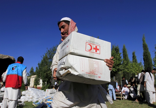 an afghan man receives aid from the international federation of the red cross and red crescent societies after an earthquake in behsud district of jalalabad province afghanistan october 28 2015 photo reuters file