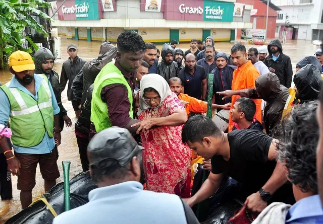 indian navy and rescue personnel evacuate local residents in an boat at aluva in the indian state of kerala on august 16 2018 photo afp indian navy and rescue personnel evacuate local residents in an boat at aluva in the indian state of kerala on august 16 2018 photo afp