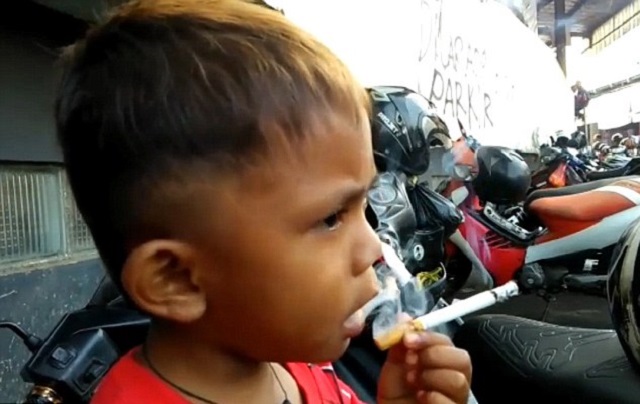 little rapi nicknamed rap is filmed happily puffing at a cigarette photo courtesy mail online