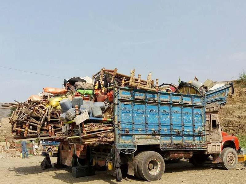 trucks carrying belongings of mohmand natives waits at torkham border photo express