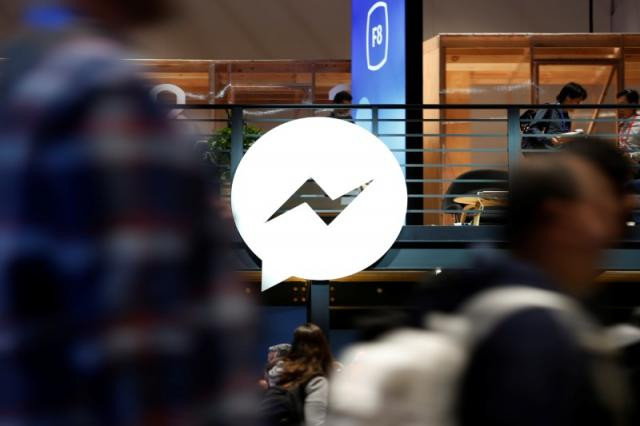 attendees walk past a facebook messenger logo during facebook 039 s annual f8 developers conference in san jose california us may 1 2018 photo reuters attendees walk past a facebook messenger logo during facebook 039 s annual f8 developers conference in san jose california us may 1 2018 photo reuters