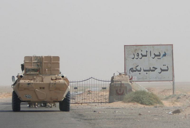 an armoured vehicle drives through oilfield photo reuters an armoured vehicle drives through oilfield photo reuters