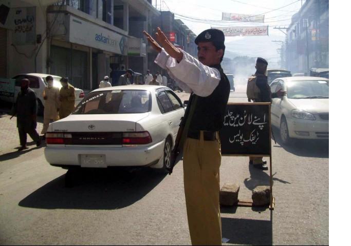 a traffic warden directs traffic photo file