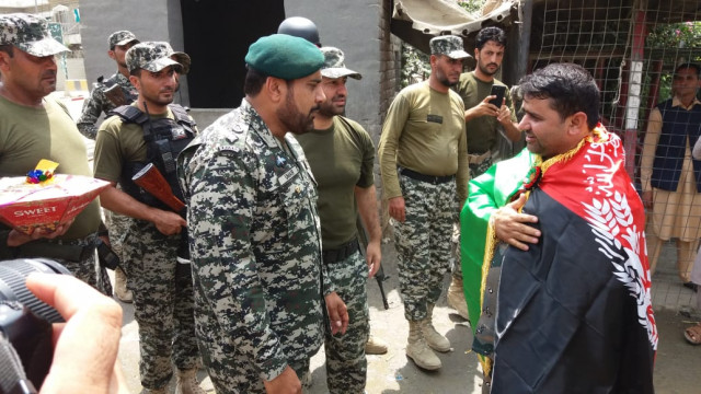 fc personnel greet afghan official on the occasion photo express