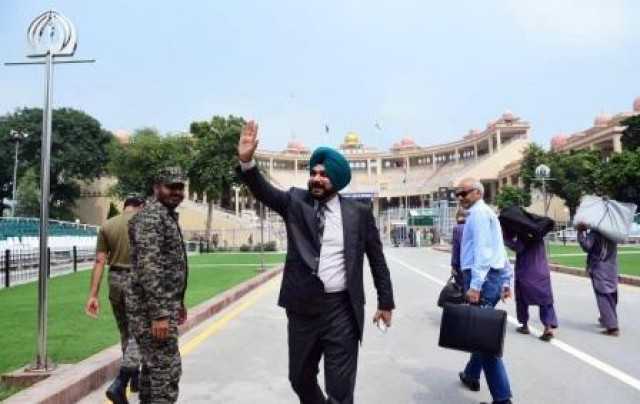 former indian cricketer navjot singh sidhu waves back to pakistan as he leaves for home via wagah border lahore photo online former indian cricketer navjot singh sidhu waves back to pakistan as he leaves for home via wagah border lahore photo online