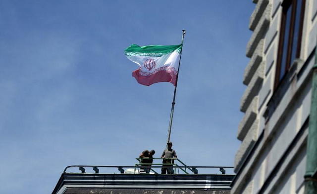 the national flag of iran is seen on top of the austrian chancellery during the visit of president hassan rouhani in vienna austria july 4 2018 photo reuters