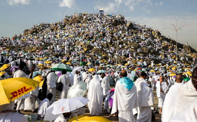 pilgrims ascend mount arafat during hajj