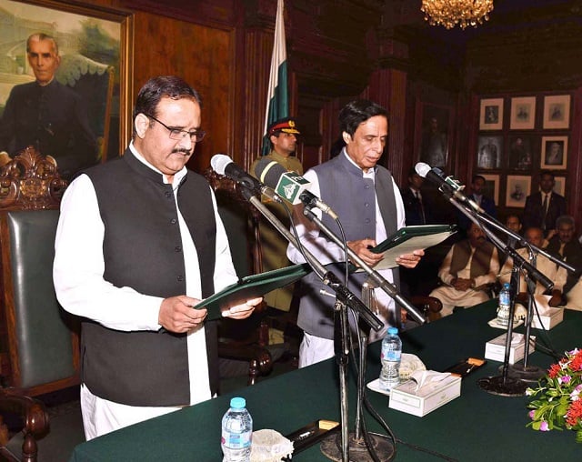 sardar usman buzdar is administered oath by acting governor punjab assembly speaker pervaiz elahi at the governor house in lahore on monday photo app