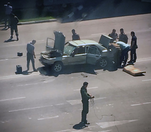 this handout photo released by the investigative committee of russia shows chechen police officers working at the site of an attack in grozny on august 20 2018 photo afp