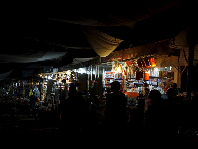 a general view of a market with shops powered by generators photo reuters