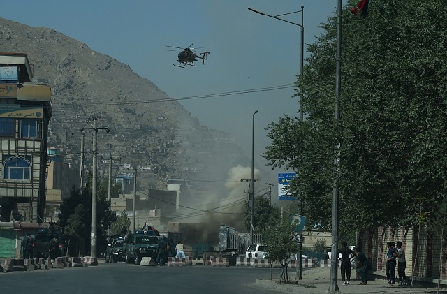 smoke and dust c rise following an air strike from an afghan military helicopter during ongoing clashes between afghan security forces and militants near the eid gah mosque in kabul on august 21 2018   military helicopters were firing above a mosque in kabul 039 s old quarter tuesday as officials said fighting had broken out between security forces and militants in the afghan capital with a barrage of rockets striking the city photo afp