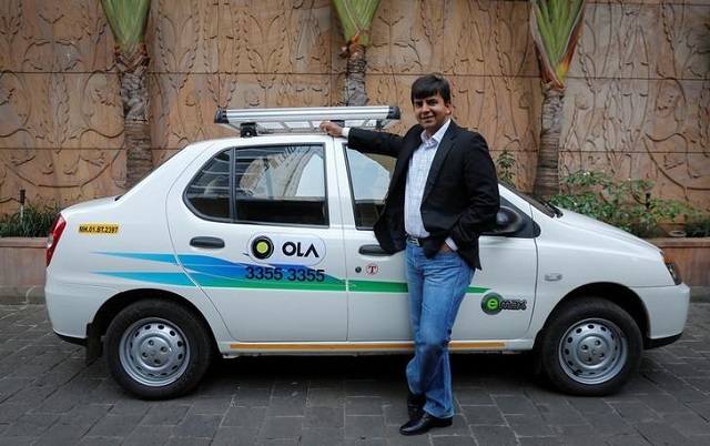 bhavish aggarwal ceo and co founder of ola an app based cab service provider poses in front of an ola cab in mumbai march 3 2015 photo reuters