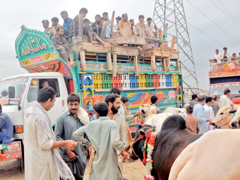 an overloaded bus leaves a bus terminal in islamabad while seventh avenue is deserted a day ahead of eidul azha photo express