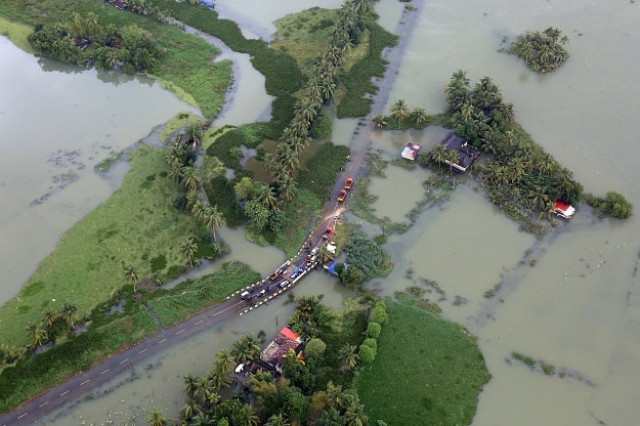 an aerial view shows partially submerged road at a flooded area in the southern state of kerala india photo reuters an aerial view shows partially submerged road at a flooded area in the southern state of kerala india photo reuters
