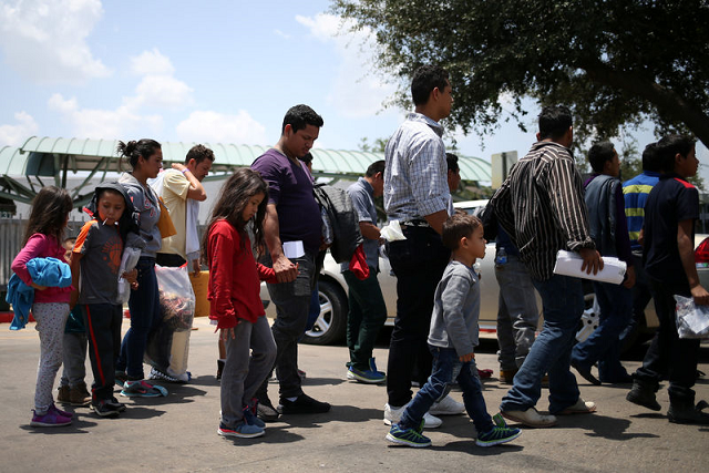 undocumented immigrant families walk from a bus depot to a respite center after being released from detention in mcallen texas us july 26 2018 photo reuters