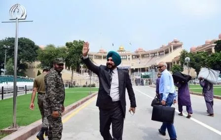 former indian cricketer navjot singh sidhu waves back to pakistan as he leaves for home via wagah border lahore photo online former indian cricketer navjot singh sidhu waves back to pakistan as he leaves for home via wagah border lahore photo online