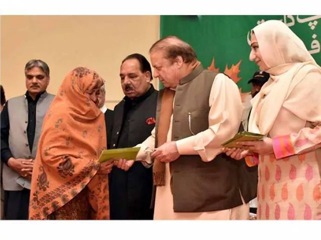 ousted pm nawaz gives health card to a deserving lady at the launch of national health programme in aj amp k photo nni ousted pm nawaz gives health card to a deserving lady at the launch of national health programme in aj amp k photo nni