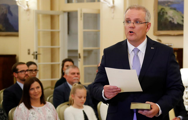 the new australian prime minister scott morrison attends a swearing in ceremony as his wife jenny looks on in canberra australia august 24 2018 photo reuters the new australian prime minister scott morrison attends a swearing in ceremony as his wife jenny looks on in canberra australia august 24 2018 photo reuters