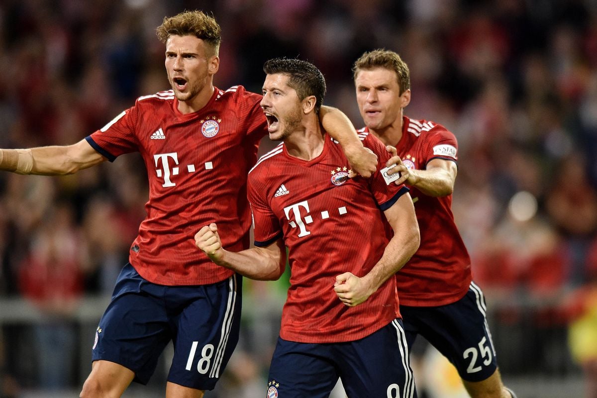 robert lewandowski of bayern muenchen celebrates scoring a goal after taking penalty for the second time during the bundesliga match between fc bayern muenchen and tsg 1899 hoffenheim at allianz arena photo afp