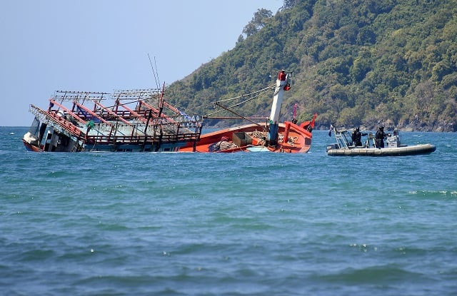 police inspect a sunken vessel at cape kimberley located near the the daintree river in northern queensland australia photo reuters police inspect a sunken vessel at cape kimberley located near the the daintree river in northern queensland australia photo reuters
