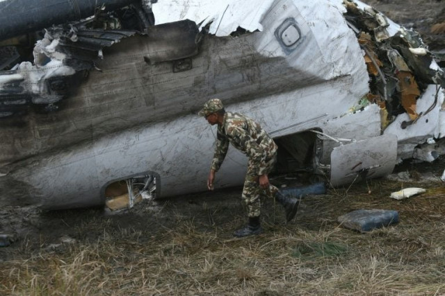 the wreckage of the airplane that crashed near the international airport in kathmandu in march an official report has blamed the pilot photo afp the wreckage of the airplane that crashed near the international airport in kathmandu in march an official report has blamed the pilot photo afp