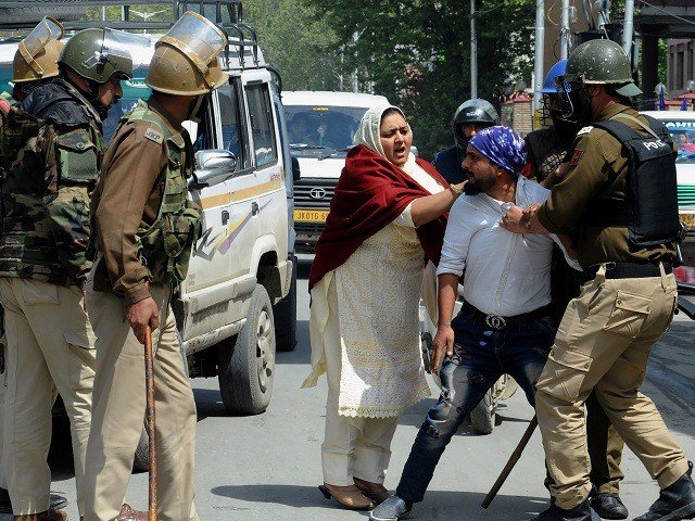 indian security personnel detain a kashmiri man during protests by students in srinagar on april 11 2018 photo afp