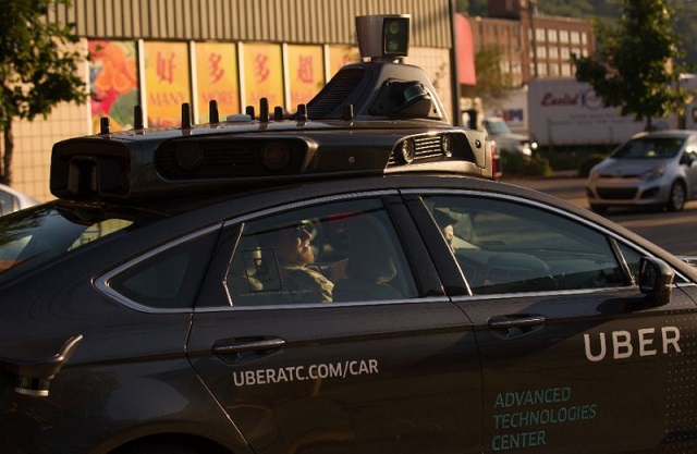 uber which has scaled back its driverless car program could ramp up efforts as part of a reported alliance with japanese auto giant toyota photo afp