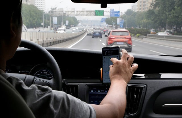 a didi chuxing driver mr liu 37 rides his electric car on the way for service in beijing china august 28 2018 photo reuters a didi chuxing driver mr liu 37 rides his electric car on the way for service in beijing china august 28 2018 photo reuters