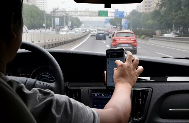a didi chuxing driver mr liu 37 rides his electric car on the way for service in beijing china august 28 2018 photo reuters a didi chuxing driver mr liu 37 rides his electric car on the way for service in beijing china august 28 2018 photo reuters