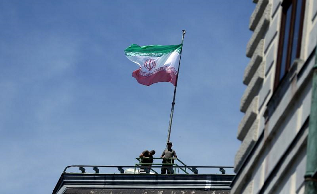 the national flag of iran is seen on top of the austrian chancellery photo reuters