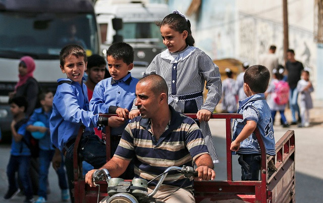 pupils are driven to a school run by the united nations agency for palestinian refugees unrwa in gaza city on august 29 2018 on the first day of classes after the summer holidays photo afp pupils are driven to a school run by the united nations agency for palestinian refugees unrwa in gaza city on august 29 2018 on the first day of classes after the summer holidays photo afp