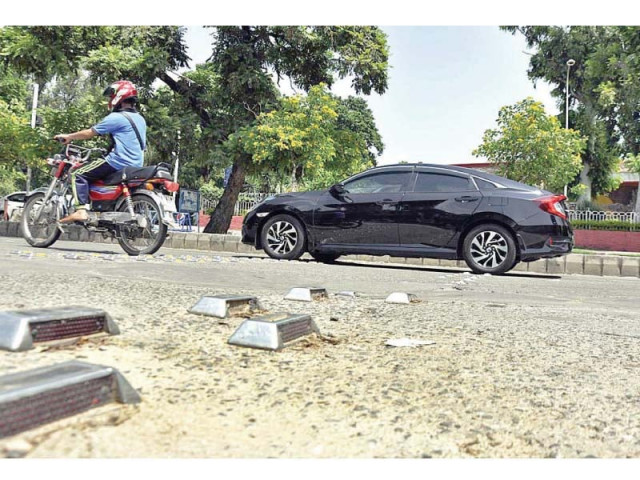 metallic reflectors seen on a road in islamabad photo app metallic reflectors seen on a road in islamabad photo app