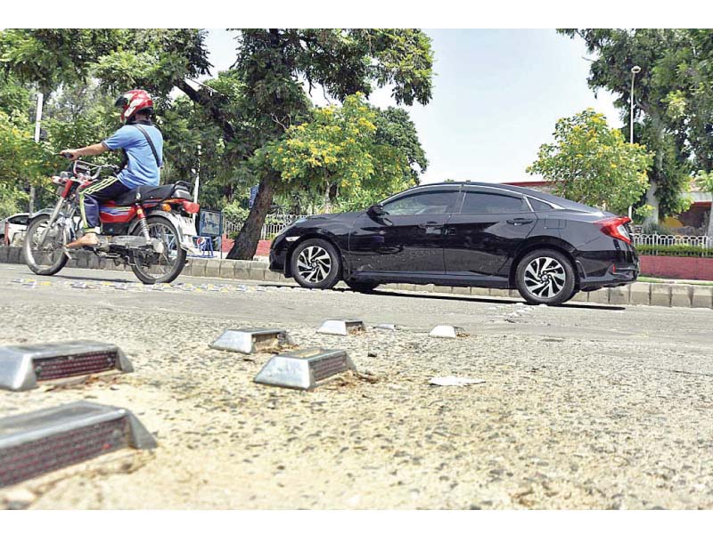 metallic reflectors seen on a road in islamabad photo app