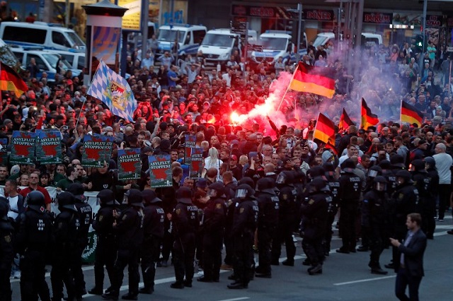 protests in the streets of berlin over the death of a 35 year old migrant photo reuters