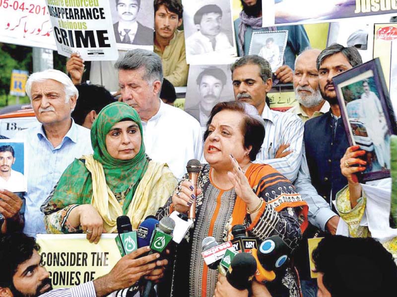 human right minister shireen mazari stands with the families of missing persons photo app