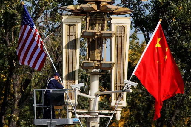 a worker places us and china flags near the forbidden city ahead of a visit by us president donald trump to beijing in beijing china november 8 2017 photo reuters a worker places us and china flags near the forbidden city ahead of a visit by us president donald trump to beijing in beijing china november 8 2017 photo reuters