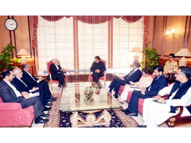 prime minister imran khan exchanges view with iranian foreign minister javad zarif photo ppi prime minister imran khan exchanges view with iranian foreign minister javad zarif photo ppi