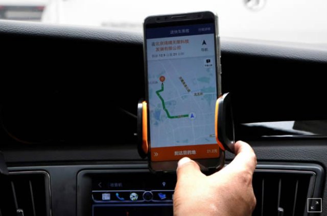 a didi chuxing driver checks the information on the application in his car in beijing china august 28 2018 photo reuters