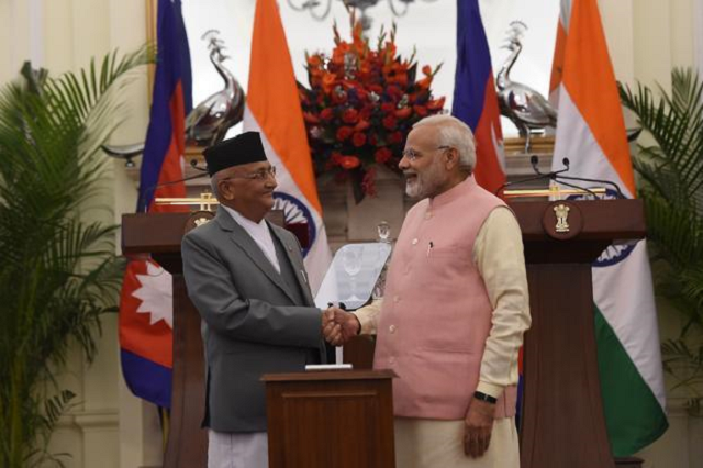 an agreement was signed by officials during a meeting between indian prime minister narendra modi and nepali prime minister k p sharma oli photo afp