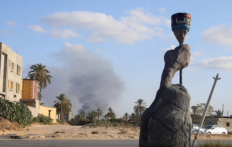 smoke rises during heavy clashes between rival factions in tripoli libya photo reuters