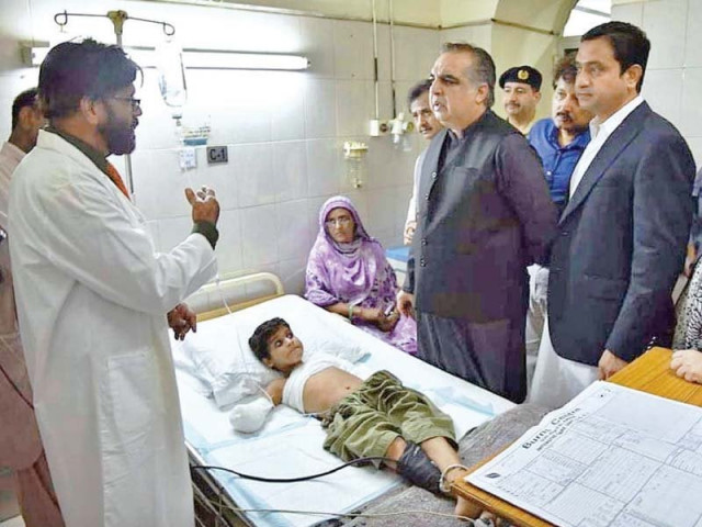 governor imran ismail being briefed at civil hospital by dr ahmer on condition of haris who sustained injuries when a wire of 11 000 volts fell on him on august 2 photo app governor imran ismail being briefed at civil hospital by dr ahmer on condition of haris who sustained injuries when a wire of 11 000 volts fell on him on august 2 photo app