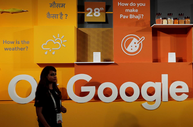 a woman walks past the logo of google during an event in new delhi india august 28 2018 photo reuters a woman walks past the logo of google during an event in new delhi india august 28 2018 photo reuters