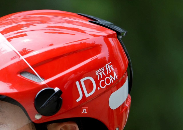 a logo of jd com is seen on a helmet of a delivery man in beijing china june 16 2014 picture taken june 16 2014 photo reuters