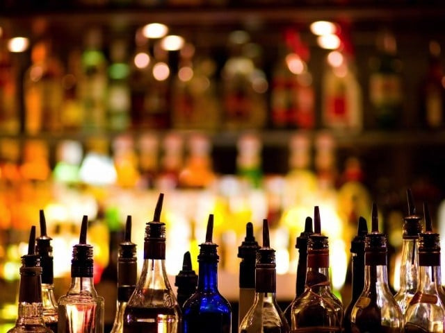 drug peddler held liquor bottles confiscated photo afp drug peddler held liquor bottles confiscated photo afp